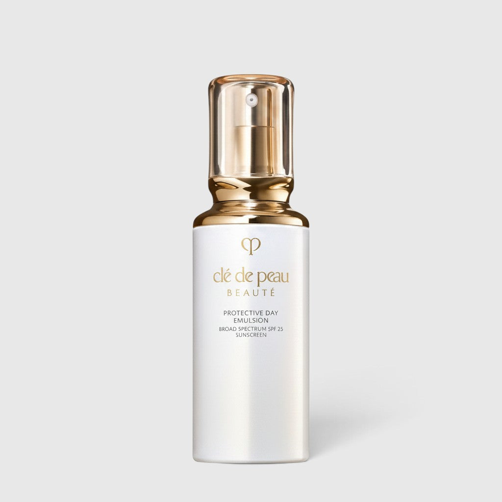Shop Rescue Spa Cle de Peau Beaute Protective Day Emulsion SPF 25 in a white pump bottle with a gold cap.