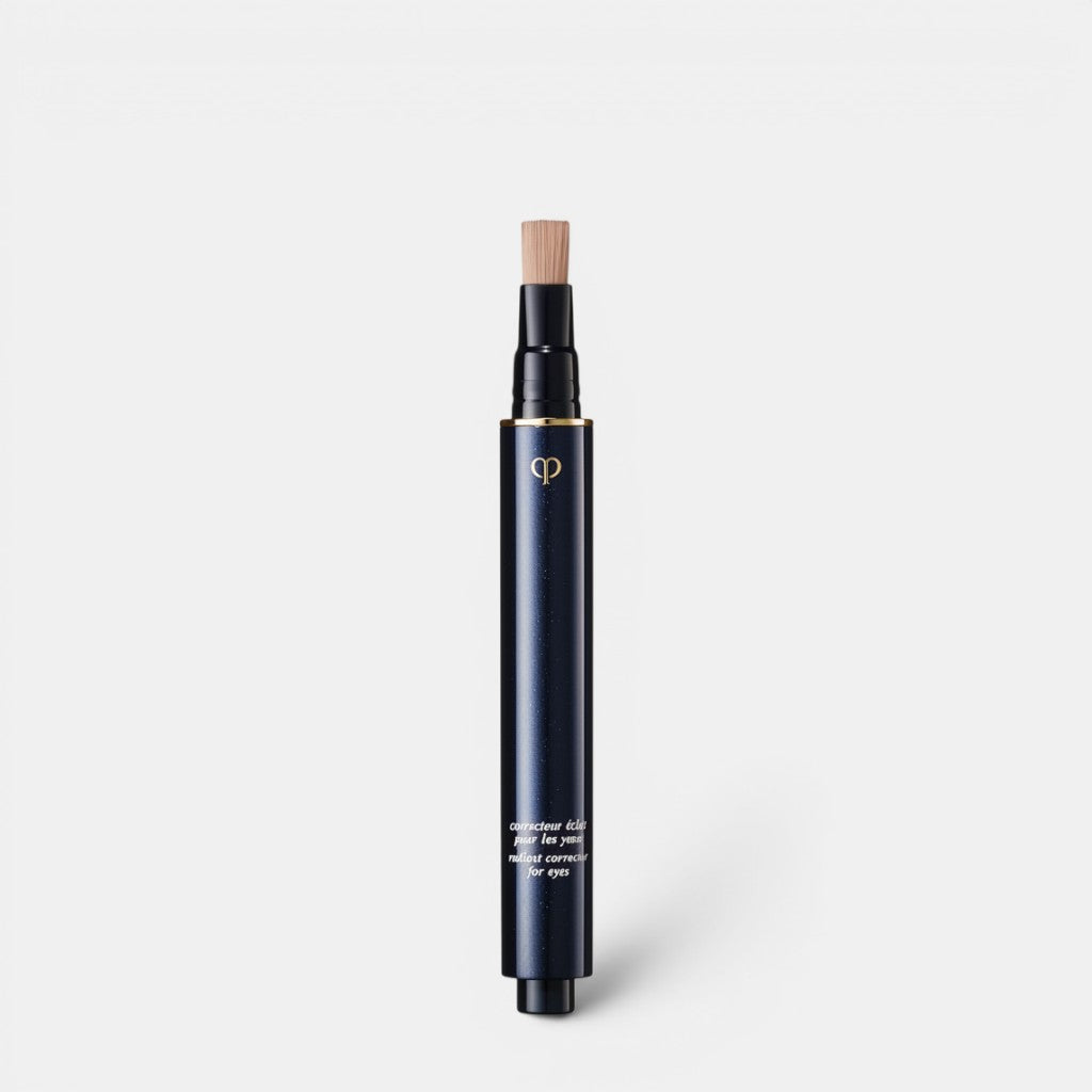 Shop Rescue Spa dark navy liquid concealer pen with gold logo and brush applicator, for brightening eyes.