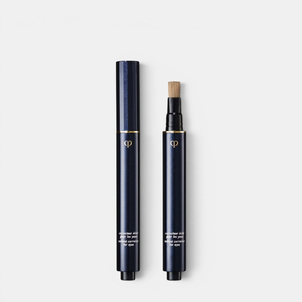Shop Rescue Spa dark navy blue pen concealer with gold accents and brush applicator. Radiant Corrector for Eyes.