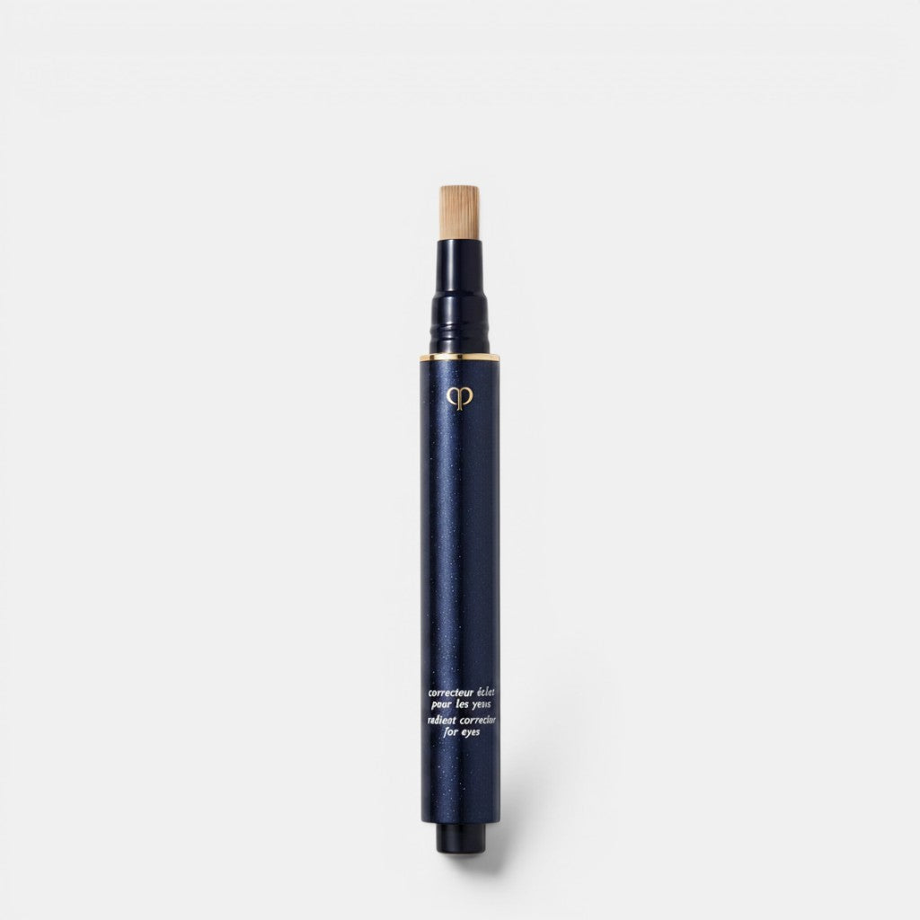 Shop Rescue Spa dark navy liquid concealer pen with gold logo and brush applicator for brighter-looking eyes.