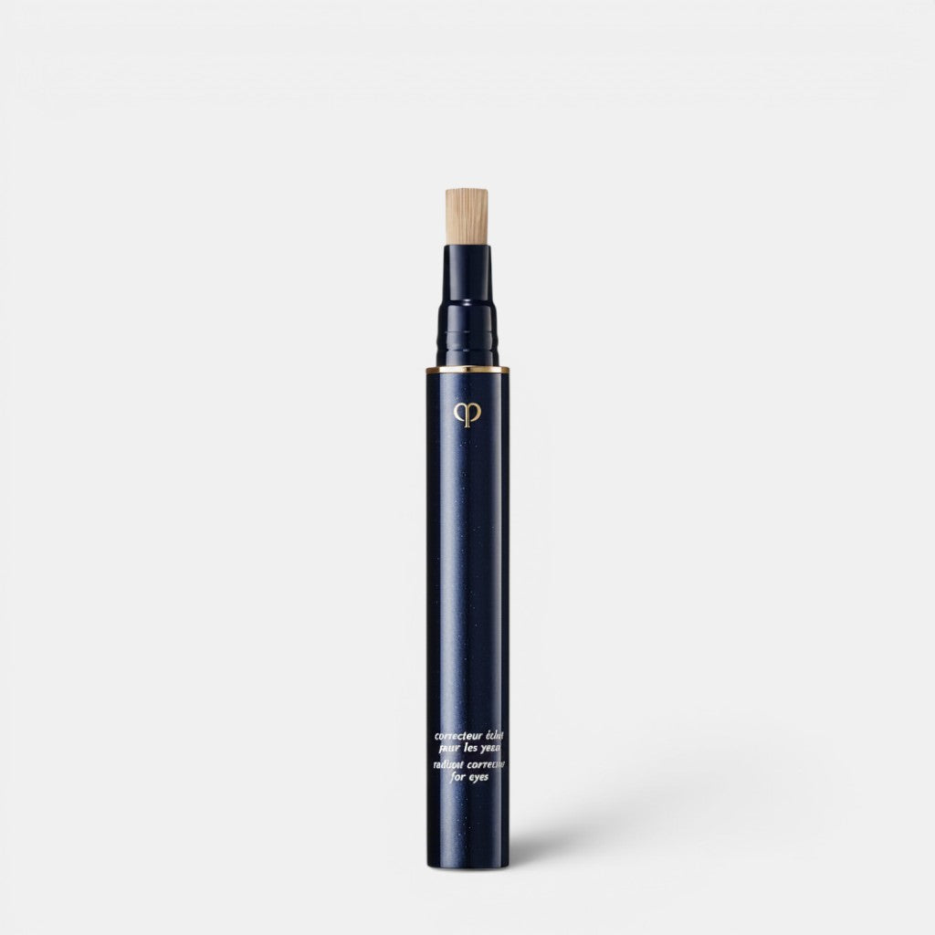 Shop Rescue Spa dark navy liquid concealer pen with gold logo and brush applicator for radiant eyes.