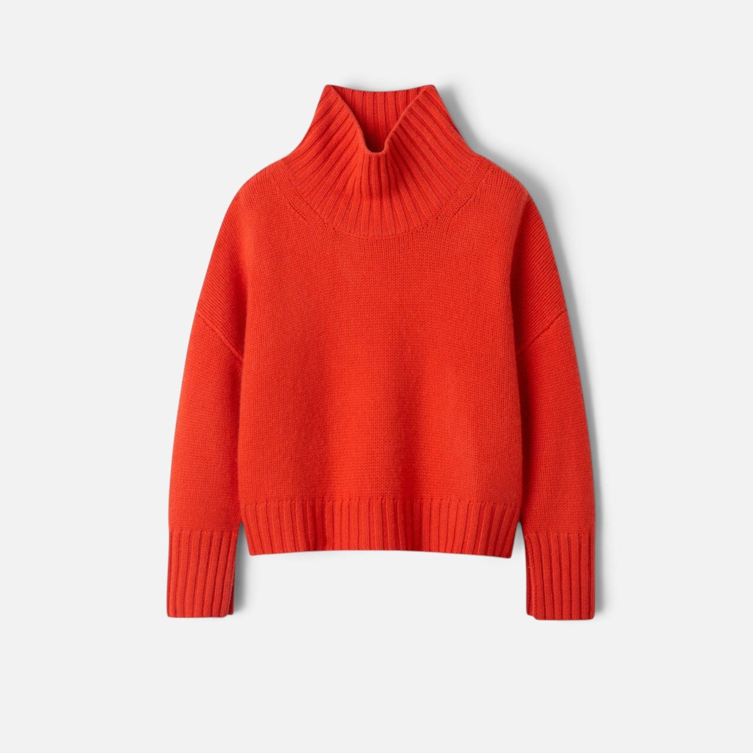 Shop Rescue Spa Girlfriend turtleneck sweater in bright red chunky knit 100% cashmere with ribbed sleeve details.