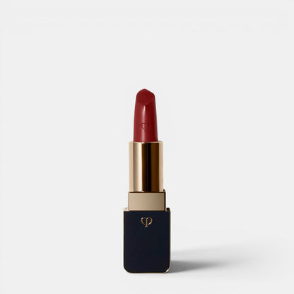 Shop Rescue Spa luxurious satin lipstick in a deep red shade with a gold and navy case.