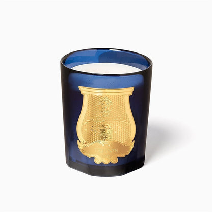 Shop Rescue Spa Reggio Classic Candle in a deep blue glass vessel with an ornate gold emblem