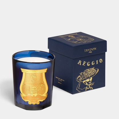 Shop Rescue Spa Reggio Classic Candle in a blue glass vessel with a gold emblem and matching navy blue gift box.