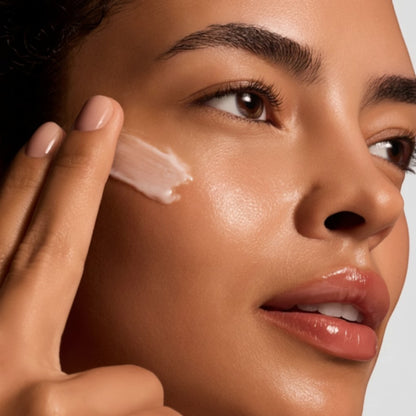 Shop Rescue Spa Reparative Moisture Emulsion applied to a woman&