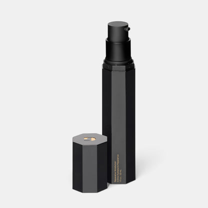 Shop Rescue Spa The Reparative Moisturizer in a sleek black hexagonal pump bottle with its cap removed.
