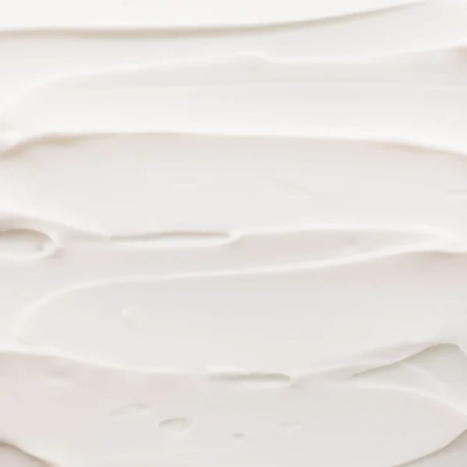 Shop Rescue Spa Rich Hand Cream texture showing a smooth, thick white moisturizing cream spread in soft swirls.
