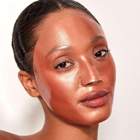 Model wearing a Shop Rescue Spa rose gold hydrogel facial treatment mask for a bright and hydrated complexion