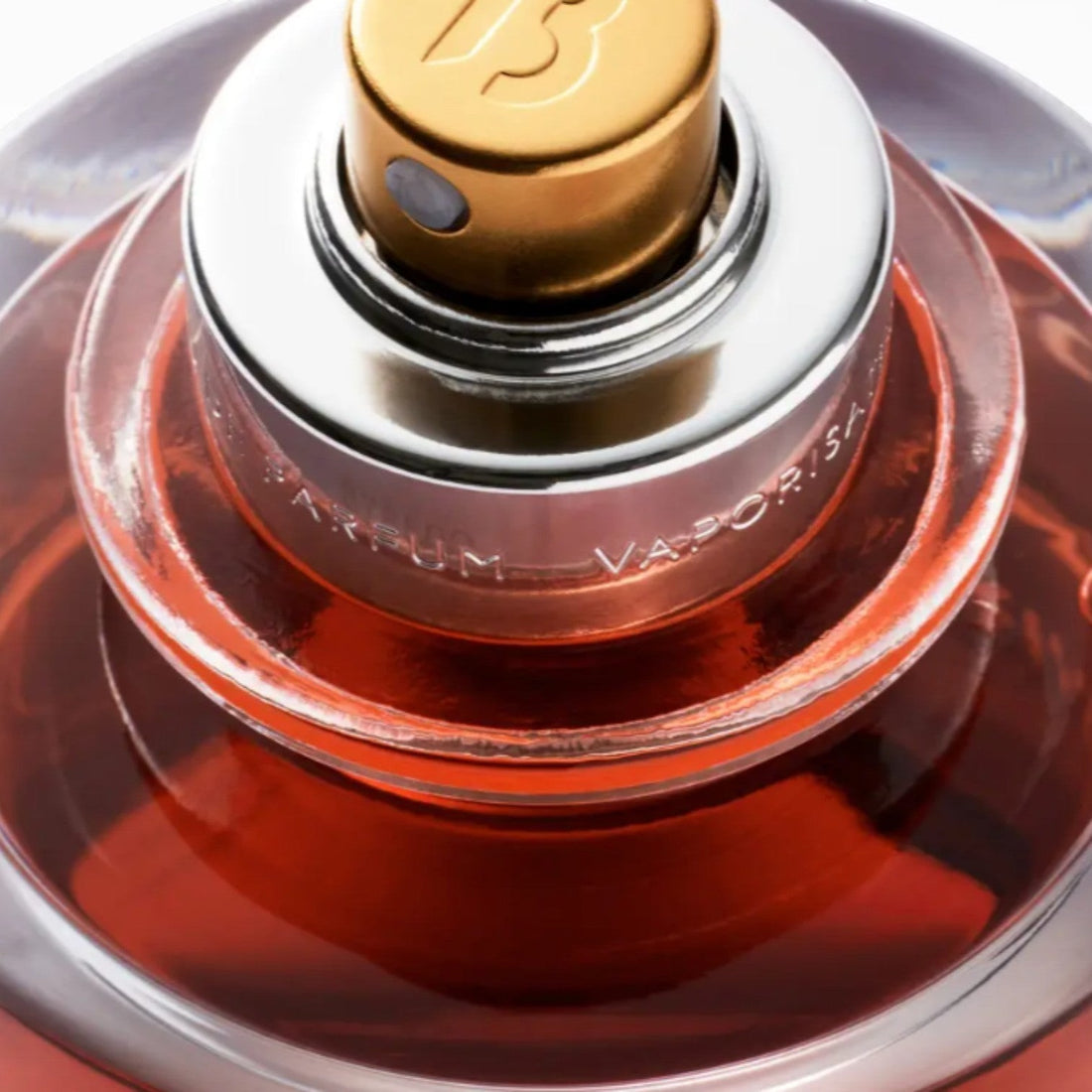 Shop Rescue Spa Rouge Chaotique Extrait De Parfum, a rich red liquid in a glass bottle with a gold cap and silver accents.