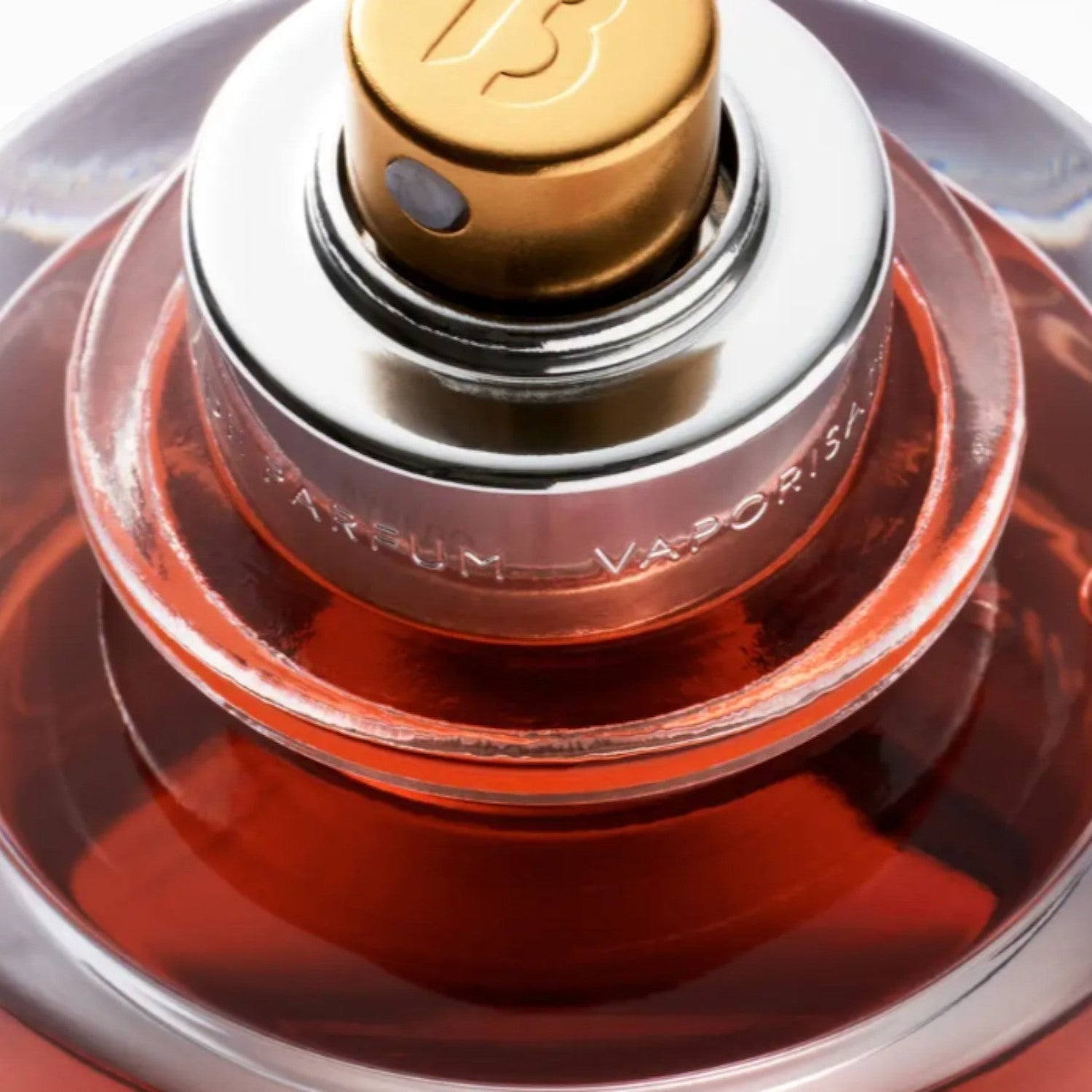 Shop Rescue Spa Rouge Chaotique Extrait De Parfum, a rich red liquid in a glass bottle with a gold cap and silver accents.