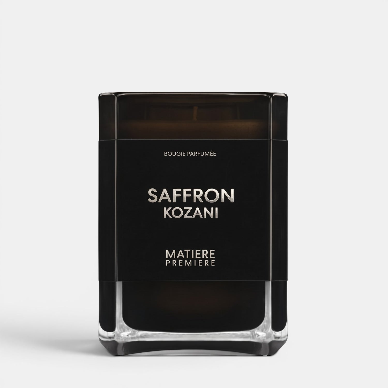 Shop Rescue Spa Saffron Kozani scented candle in a sleek black glass jar with minimalist white typography.