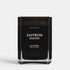 Shop Rescue Spa Saffron Kozani scented candle in a sleek black glass jar with minimalist white typography.