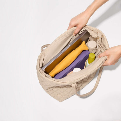 Shop Rescue Spa Sand Small Daily Tote in quilted nylon with organized interior pockets, laptop, and water bottles.