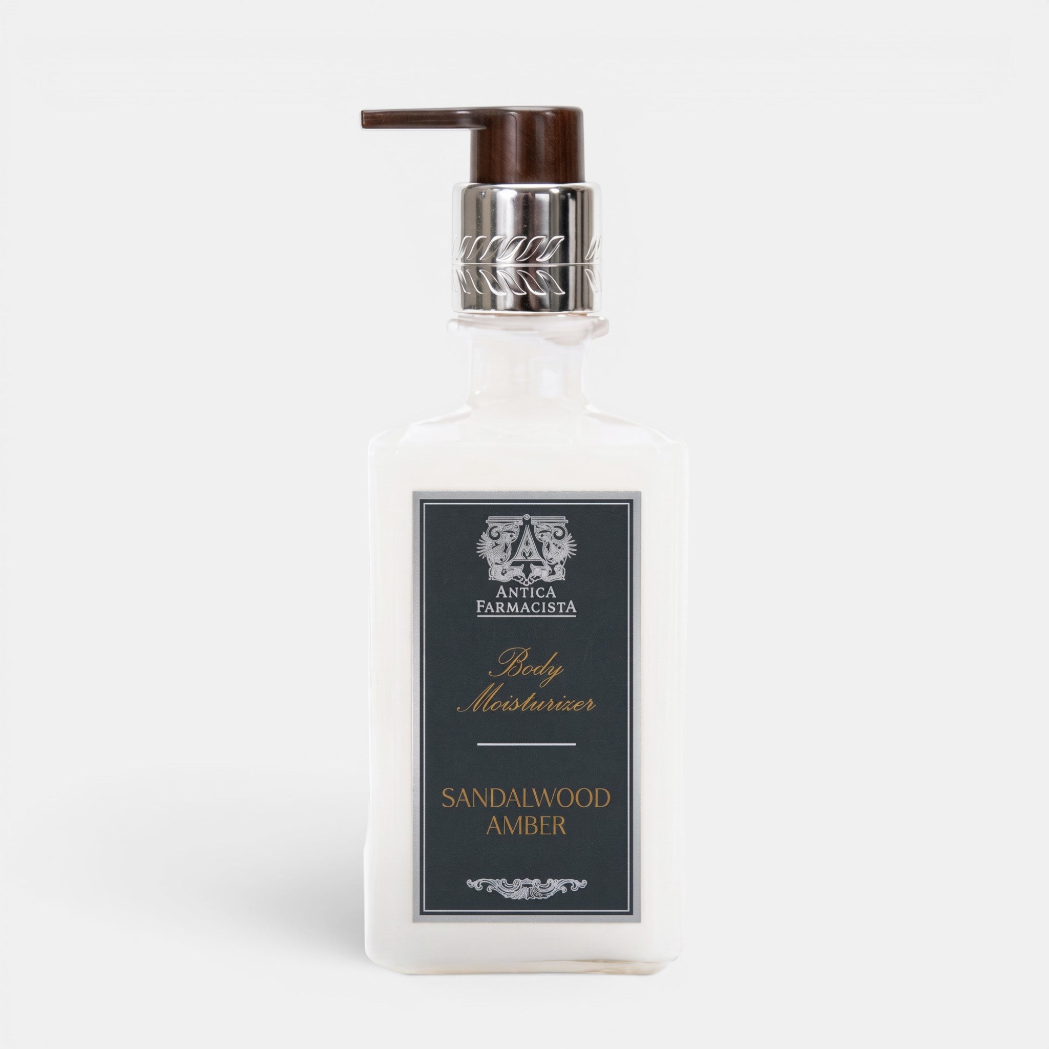 Shop Rescue Spa Antica Farmacista Sandalwood Amber body moisturizer in a clear pump bottle with a dark brown cap.