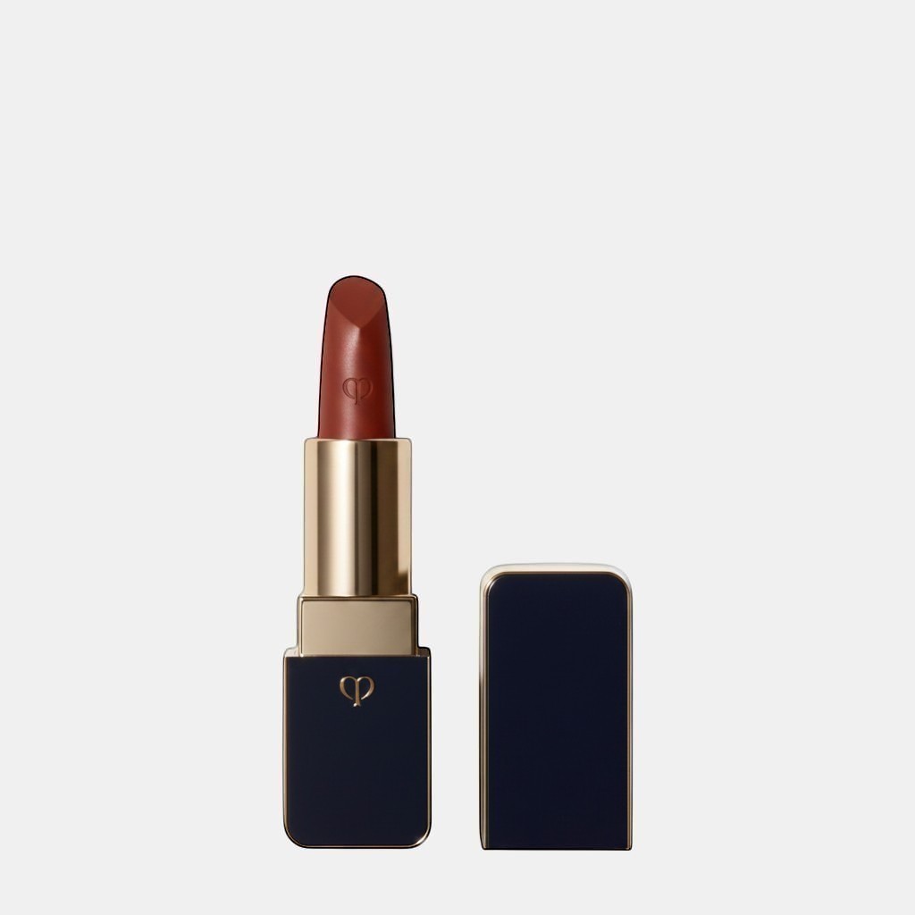 Shop Rescue Spa luxurious satin lipstick in a rich, warm brown shade with a lustrous finish and gold accents.