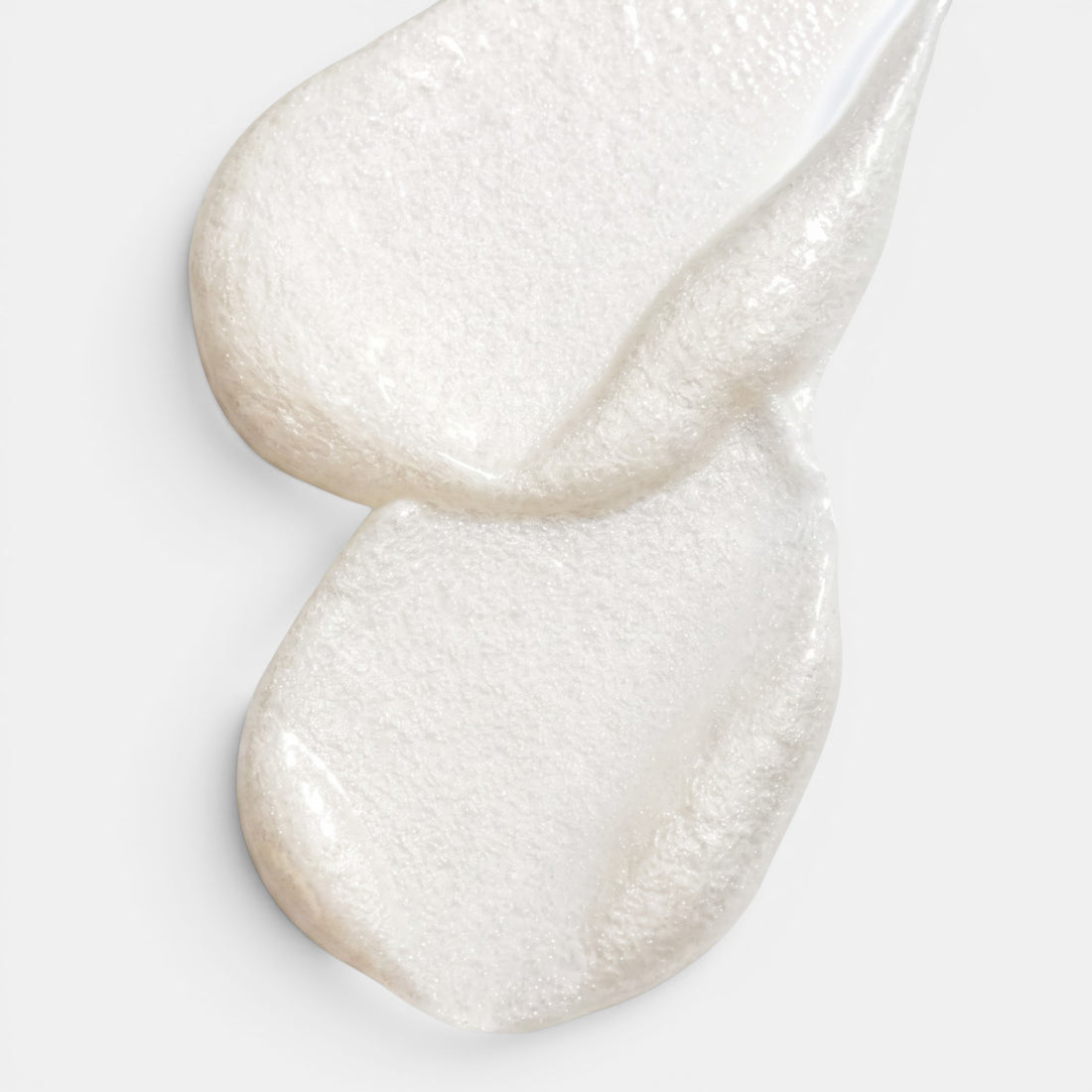 Shop Rescue Spa Scalp Booster leave-in serum with a pearlescent white, smooth gel-like texture on a white background.