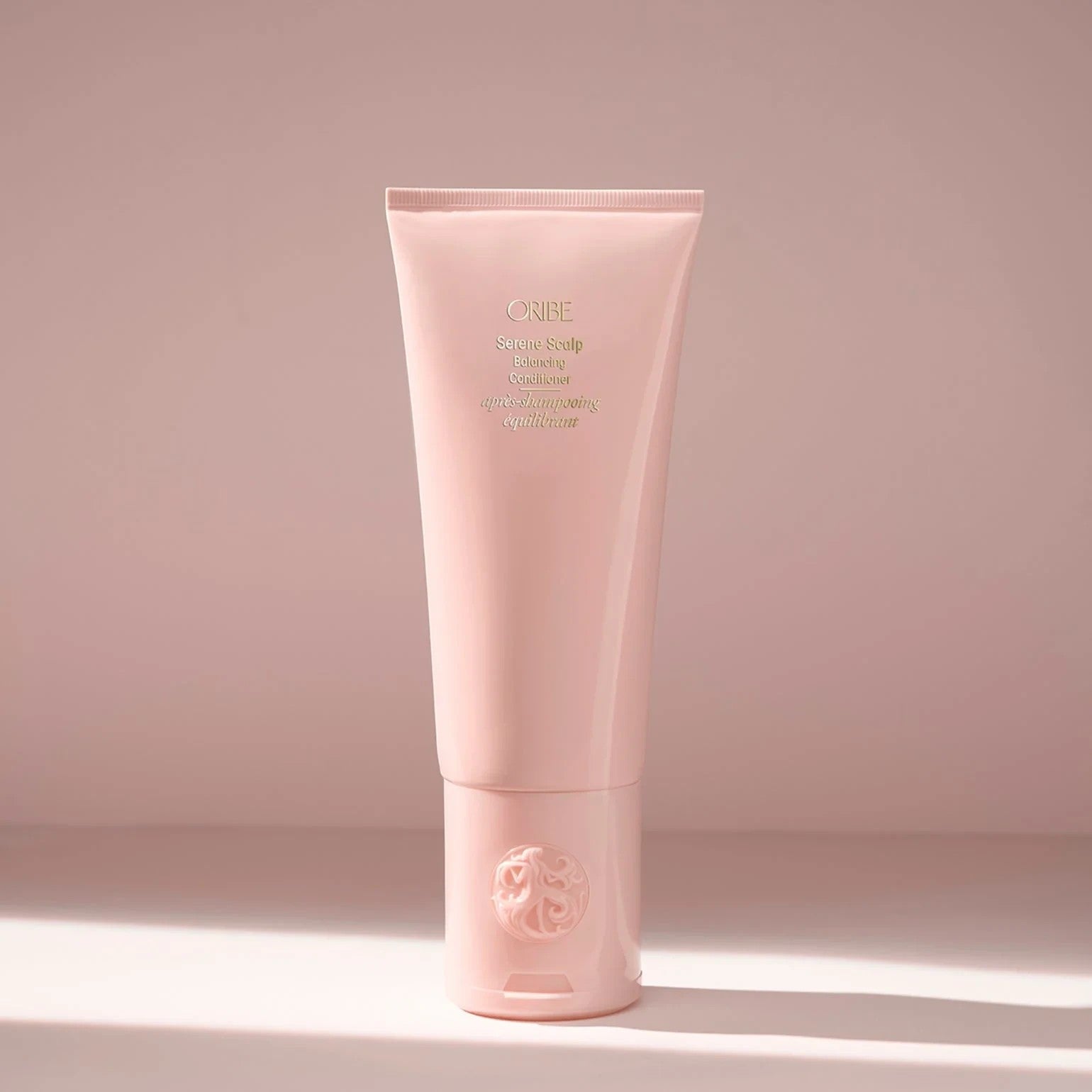 Shop Rescue Spa ORIBE Serene Scalp Balancing Conditioner in a pale pink tube, hydrating and soothing for hair and scalp.