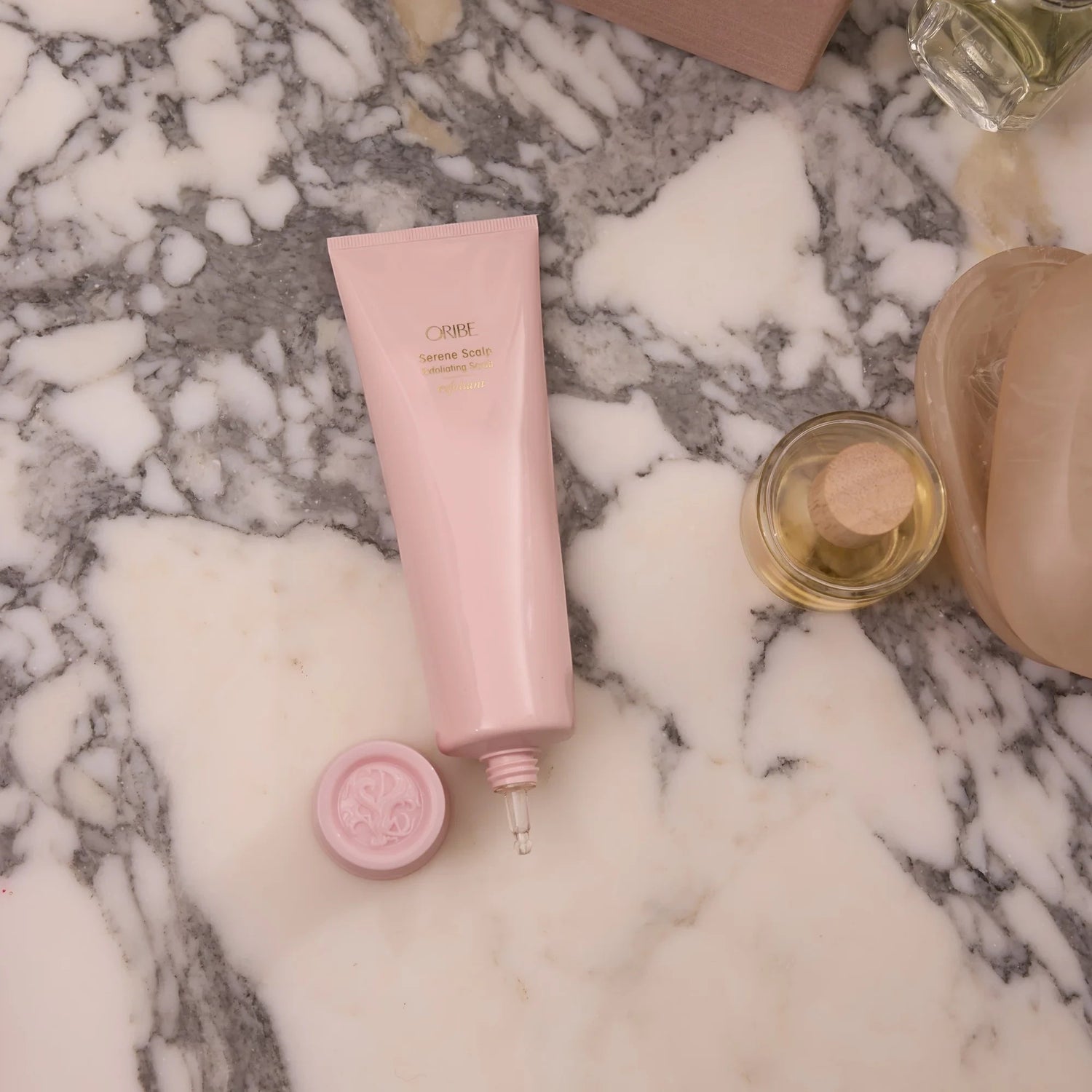 Shop Rescue Spa pink tube of Serene Scalp Exfoliating Scrub with cap off, showing applicator tip.