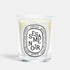 Shop Rescue Spa Sesame Noir scented candle in a clear glass vessel with a signature oval label
