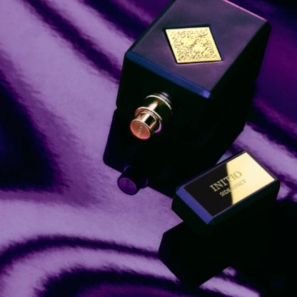 Shop Rescue Spa Side Effect Eau De Parfum bottle with gold accents on a purple, rippled background.