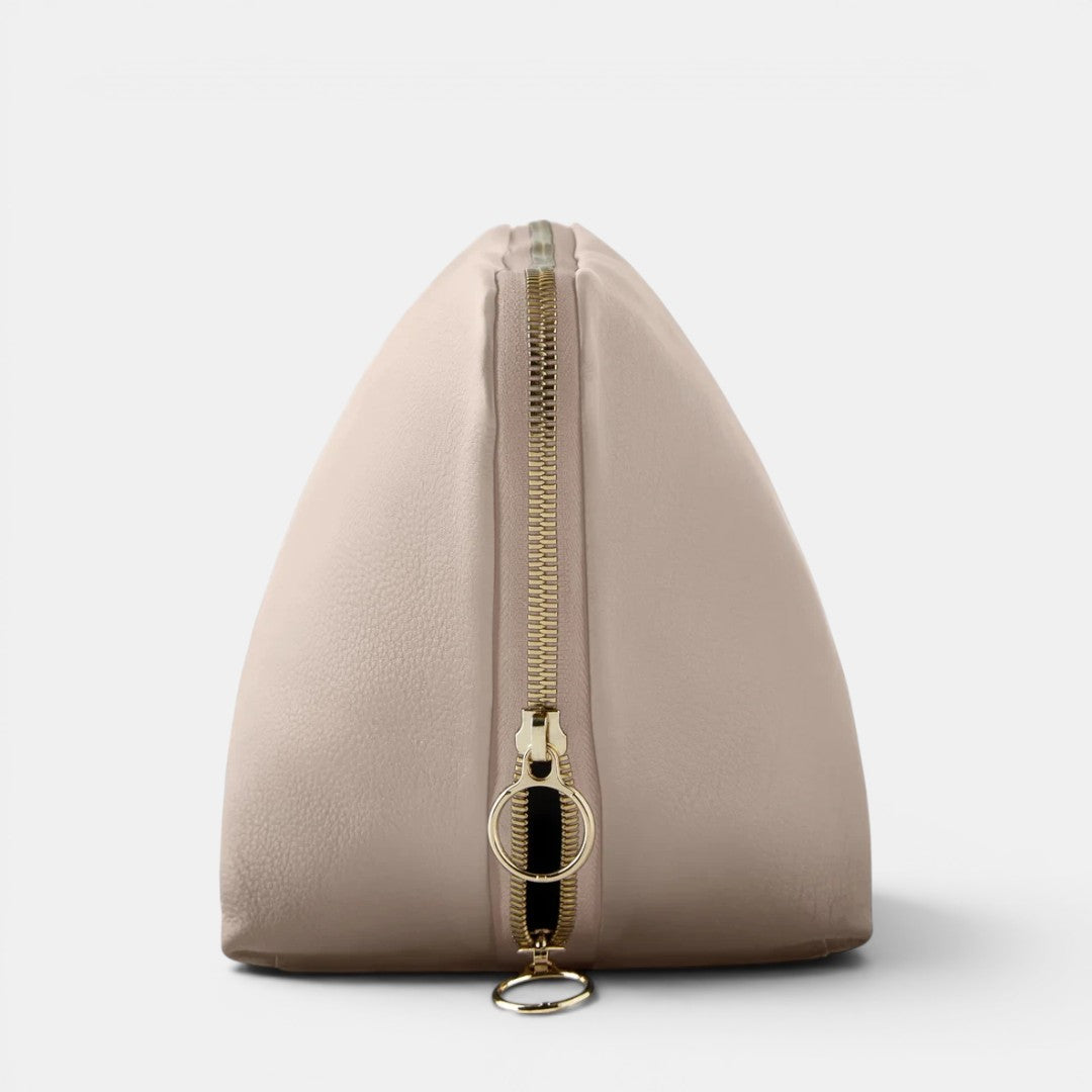 Shop Rescue Spa Signature Makeup Bag in beige leather with gold zipper. Ideal for travel and beauty collections.