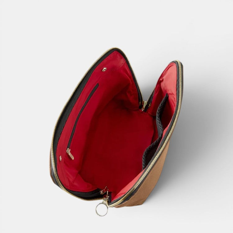 Shop Rescue Spa Signature brown leather makeup bag with red interior, zip-out liner, and interior pockets.