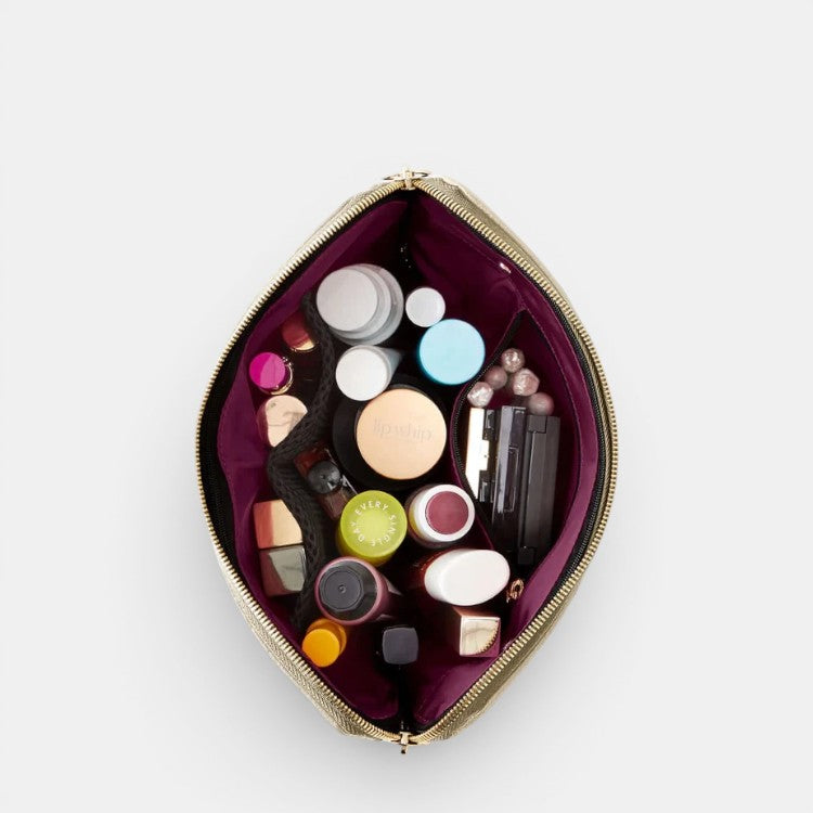 Shop Rescue Spa Signature Leather Makeup Bag with multiple compartments and various makeup products inside.