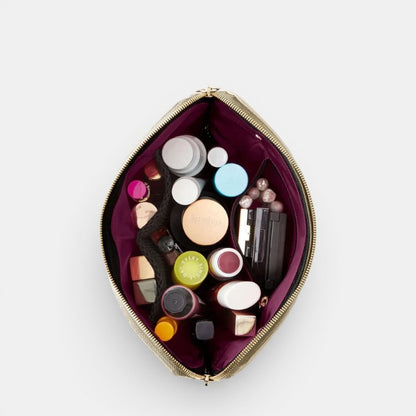 Shop Rescue Spa Signature Leather Makeup Bag with multiple compartments and various makeup products inside.