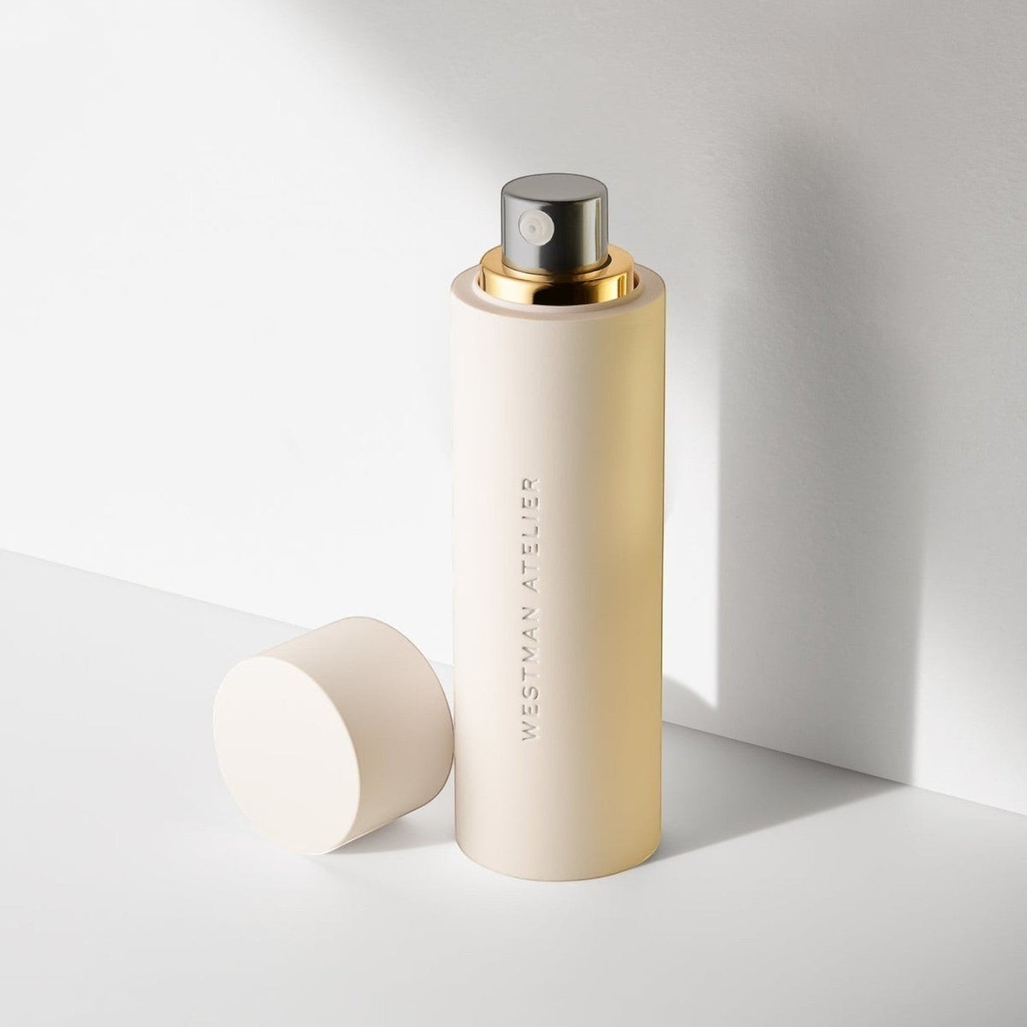 Shop Rescue Spa Skin Activator Serum in a cylindrical beige bottle with a gold pump and matching cap.