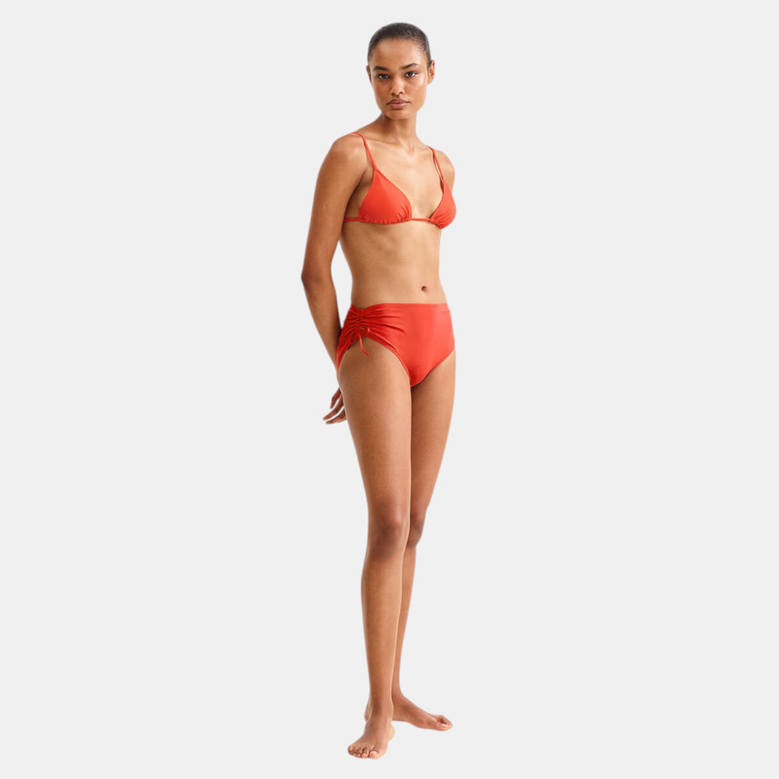 Shop Rescue Spa Sofia Rooibos mid-rise bikini briefs in coral red with side ties and shirring.