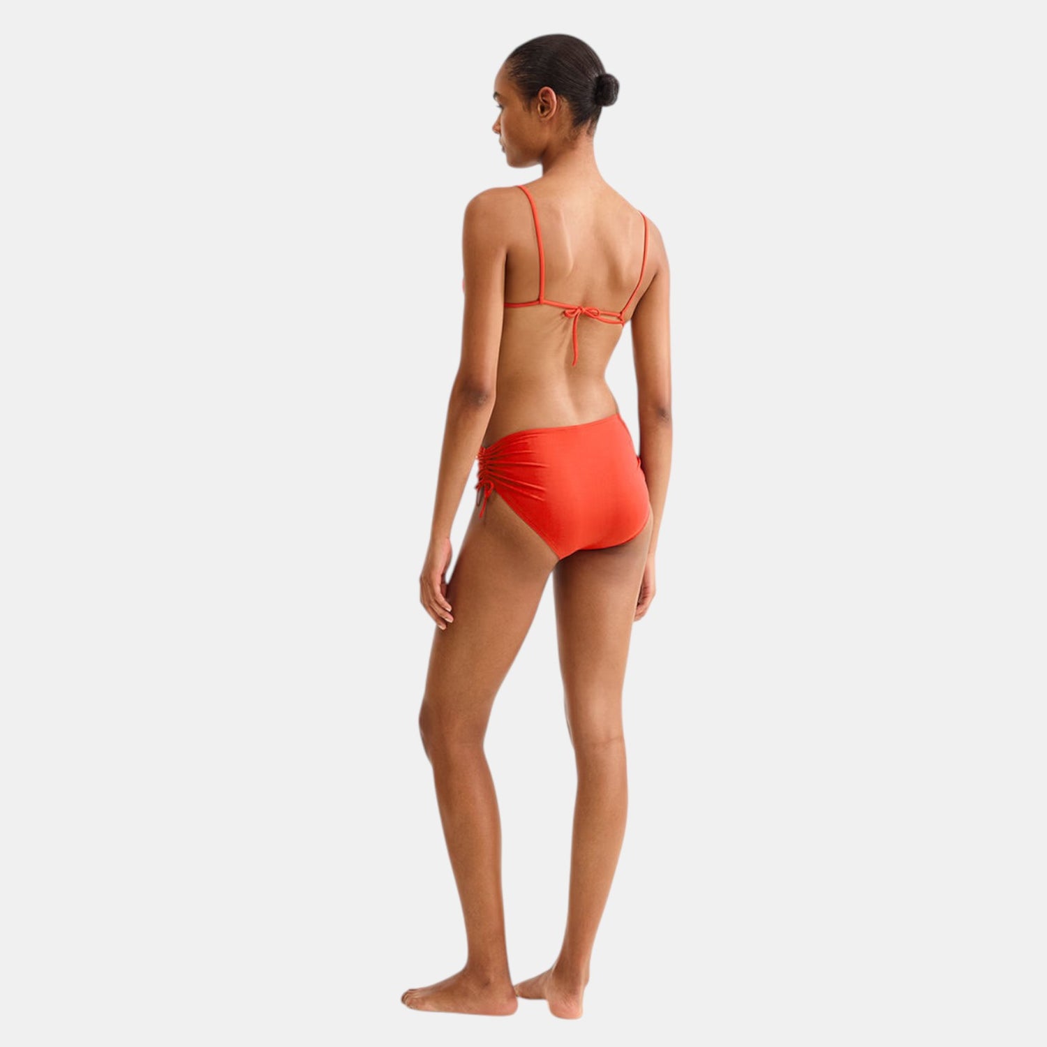 Shop Rescue Spa Sofia mid-rise bikini briefs in rooibos orange with side ties and shirring.