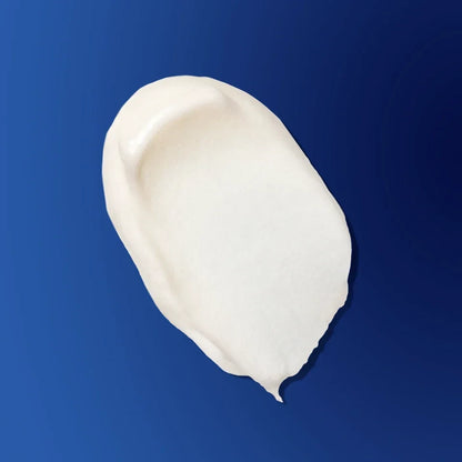 Shop Rescue Spa The Ultimate Soothing Cream texture swatch showing a rich white moisturizing cream on a blue background