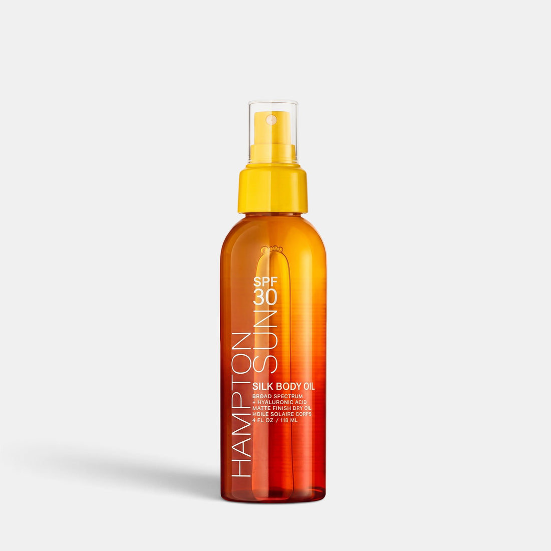 Shop Rescue Spa SPF 30 Silk Body Oil in a clear amber spray bottle with a yellow cap for lightweight sun protection.