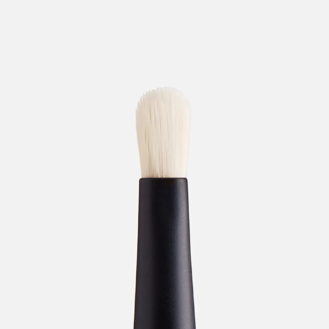 Shop Rescue Spa Spot Check Brush with a pointed white nylon tip and black handle for precise concealer application.