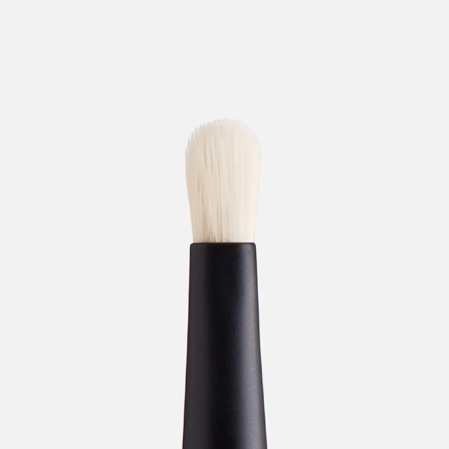 Shop Rescue Spa Spot Check Brush with a pointed white nylon tip and black handle for precise concealer application.