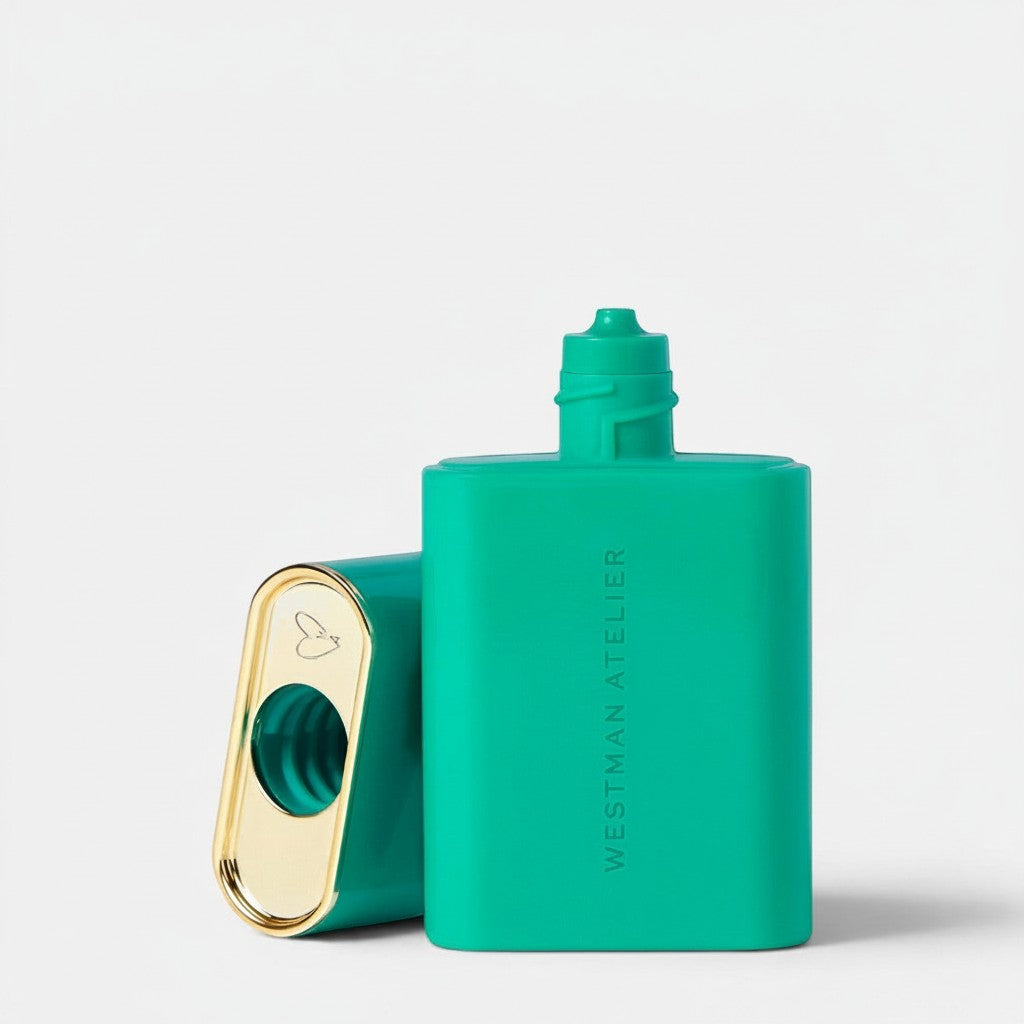Shop Rescue Spa Sun Tone Bronzing Drops in a vibrant green bottle with a gold-accented cap on a white background.