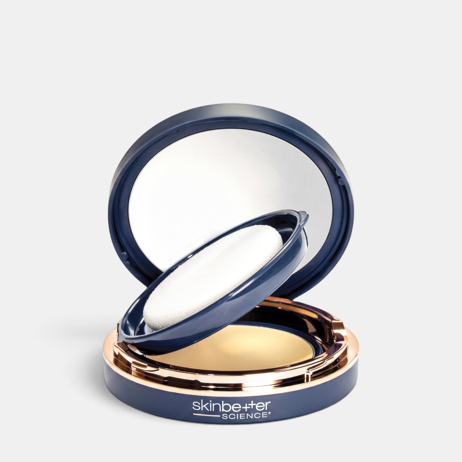 Shop Rescue Spa sunbetter Tone Smart SPF 68 sunscreen compact in a navy blue case with a mirror and applicator puff.