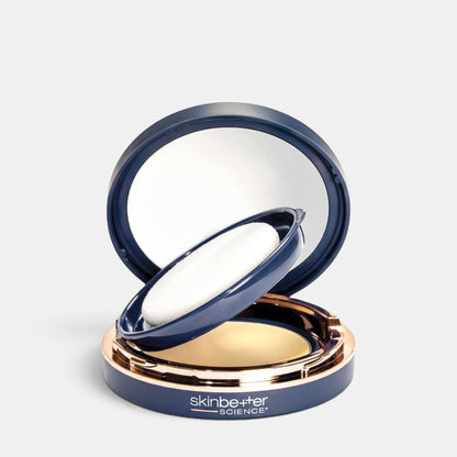 Shop Rescue Spa sunbetter Tone Smart SPF 68 sunscreen compact in a navy blue case with a mirror and applicator puff.