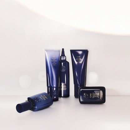 Shop Rescue Spa Oribe Supershine Light Moisturizing Cream in a blue tube, with other Oribe hair products.