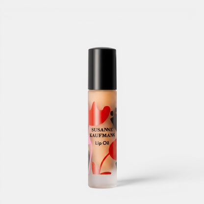 Shop Rescue Spa Susanne Kaufmann lip oil in a clear glass rollerball bottle with red floral pattern design