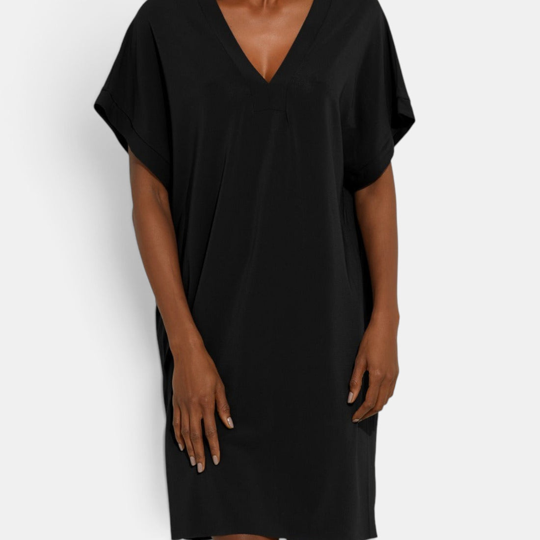 Shop Rescue Spa TALI black short tunic with a V-neckline, short sleeves, and a raw hem detail.