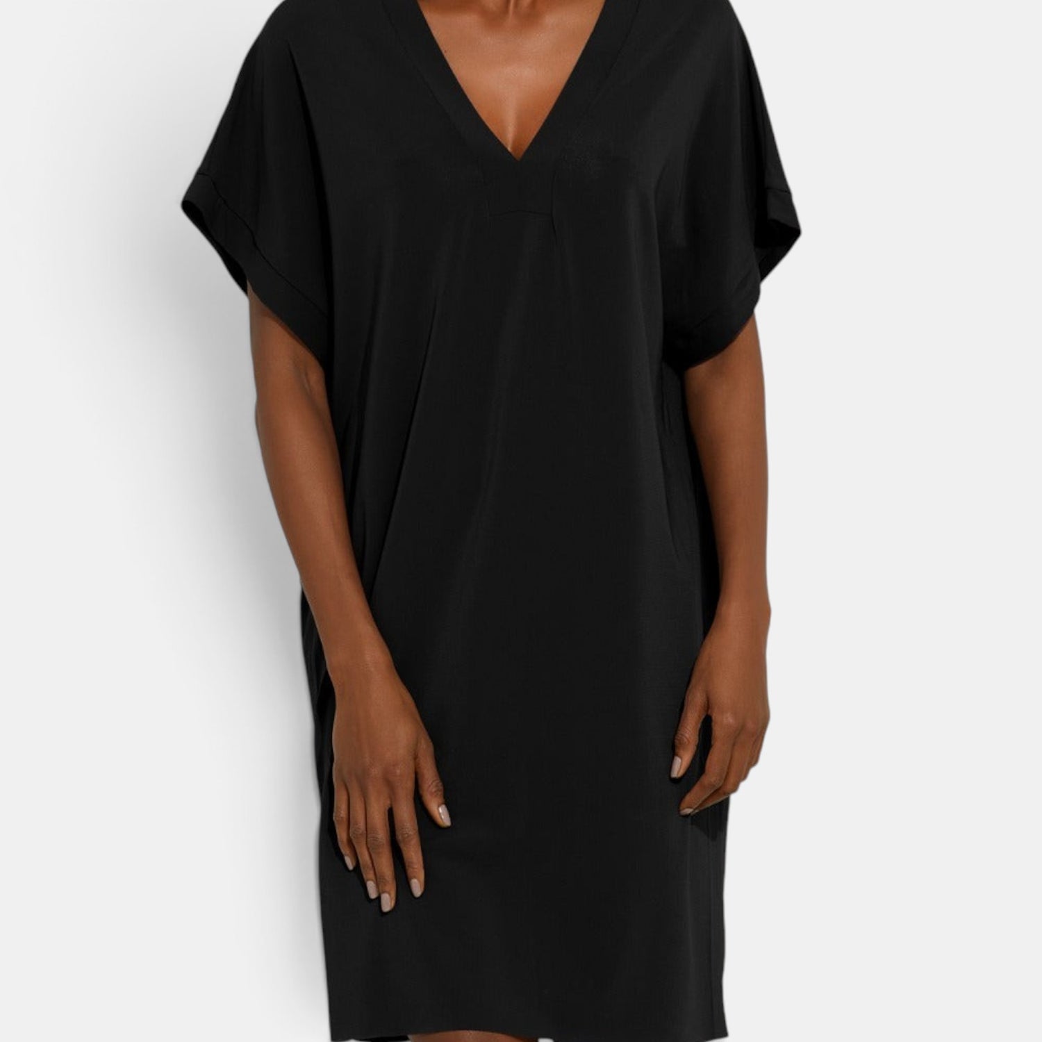 Shop Rescue Spa TALI black short tunic with a V-neckline, short sleeves, and a raw hem detail.