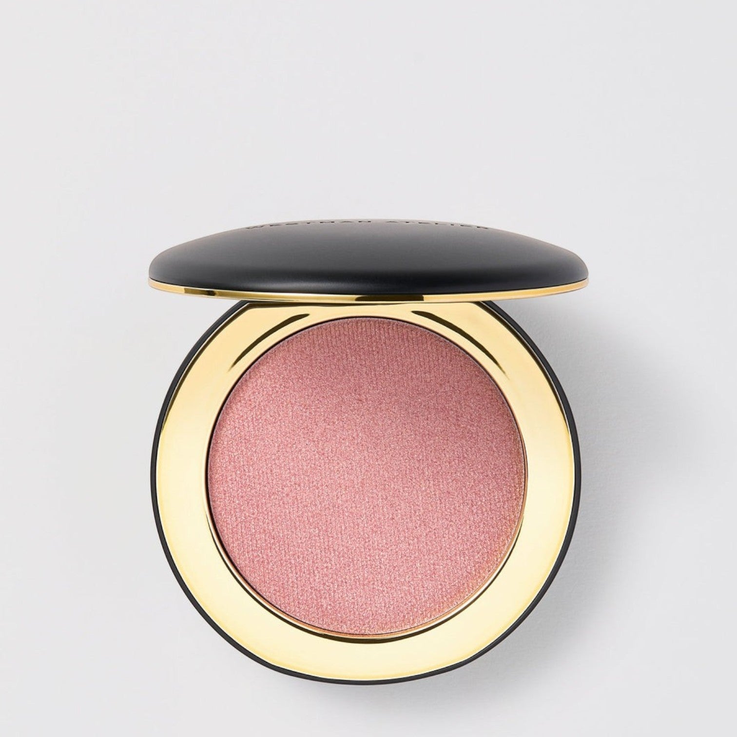 Shop Rescue Spa Super Loaded Tinted Highlight in a shimmering pink cream formula inside a sleek black and gold compact.