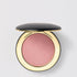 Shop Rescue Spa Super Loaded Tinted Highlight in a shimmering pink cream formula inside a sleek black and gold compact.