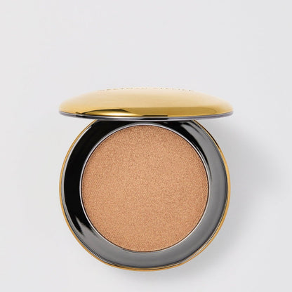Shop Rescue Spa Super Loaded Tinted Highlight cream in a shimmering gold shade with a sleek compact case.