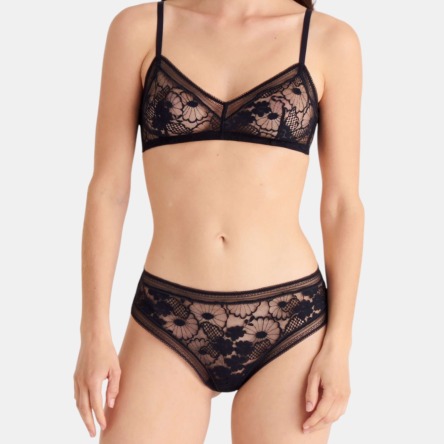 Shop Rescue Spa Tisane black lace lingerie set featuring a floral pattern bralette and matching tanga underwear.