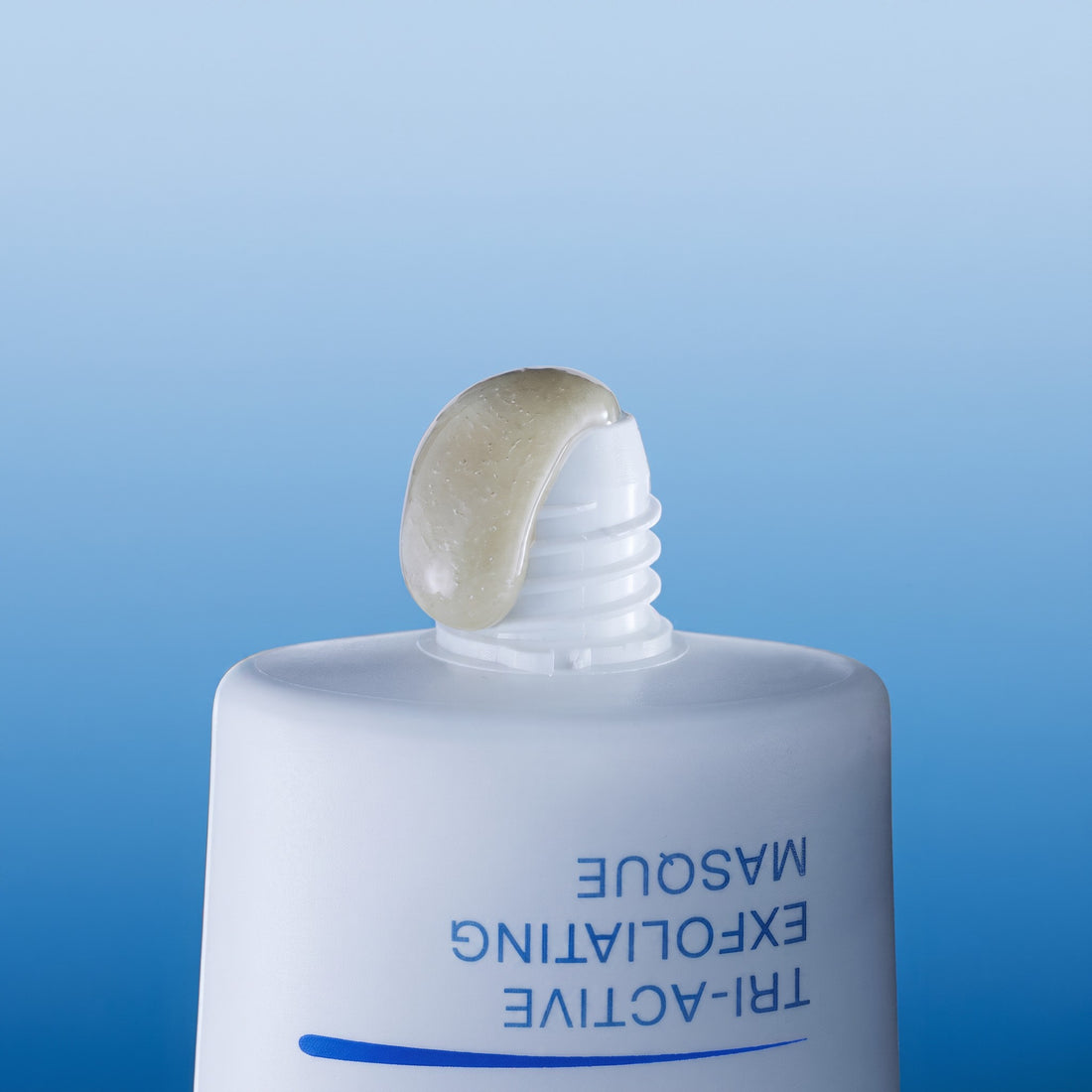 Shop Rescue Spa Tri-Active Exfoliating Masque with a dollop of translucent exfoliating gel on the tube nozzle