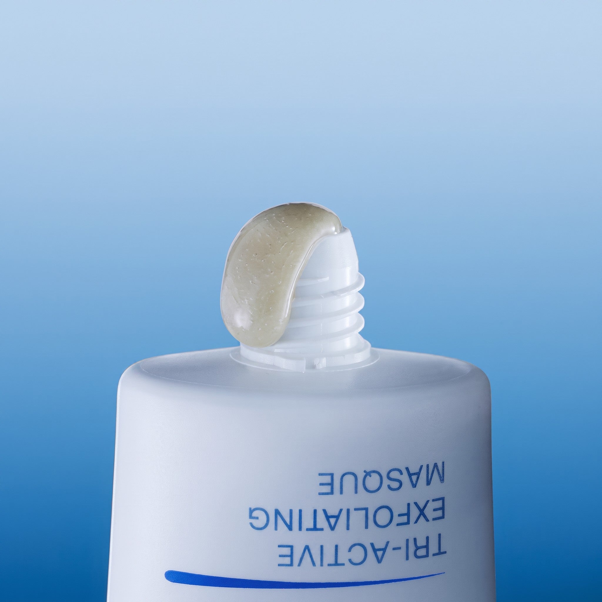 Shop Rescue Spa Tri-Active Exfoliating Masque with a dollop of translucent exfoliating gel on the tube nozzle