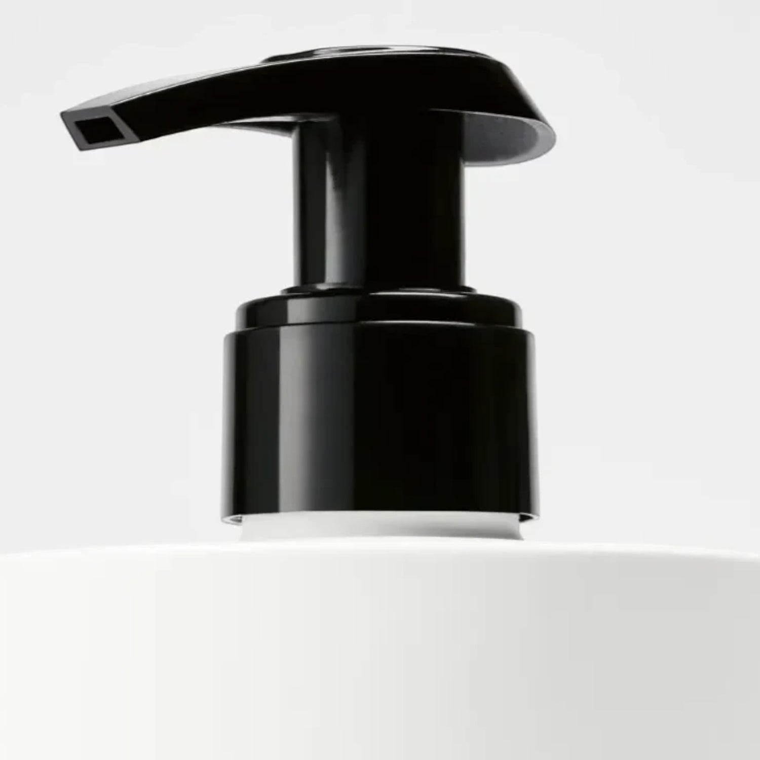 Shop Rescue Spa Tulipmania Hand Lotion with black pump dispenser and white bottle. Notes of freesia, tulip, and blonde woods.